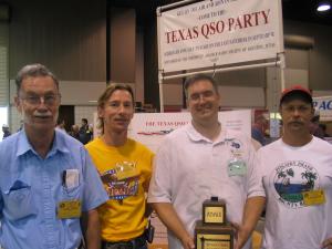KI5DR accepts the trophy for CTDXCC's victory in the club 
competition of the 2003 Texas QSO Party!